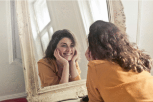 Woman Smiling at Mirror